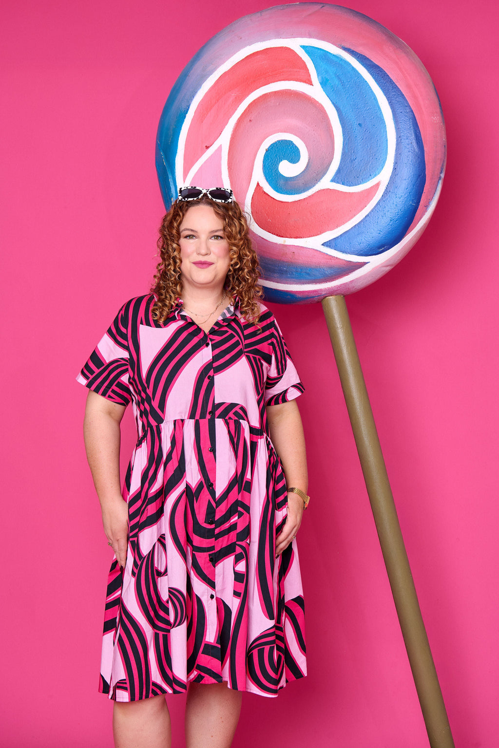 Model wearing Toomi Liquorice Swirl cotton midi babydoll dress with button-up collar
