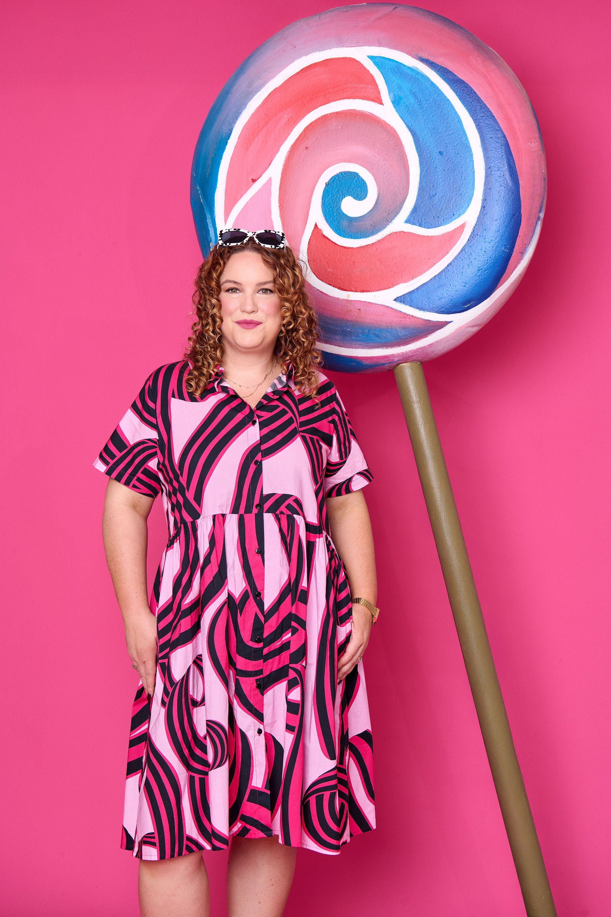 Model wearing Toomi Liquorice Swirl cotton midi babydoll dress with button-up collar