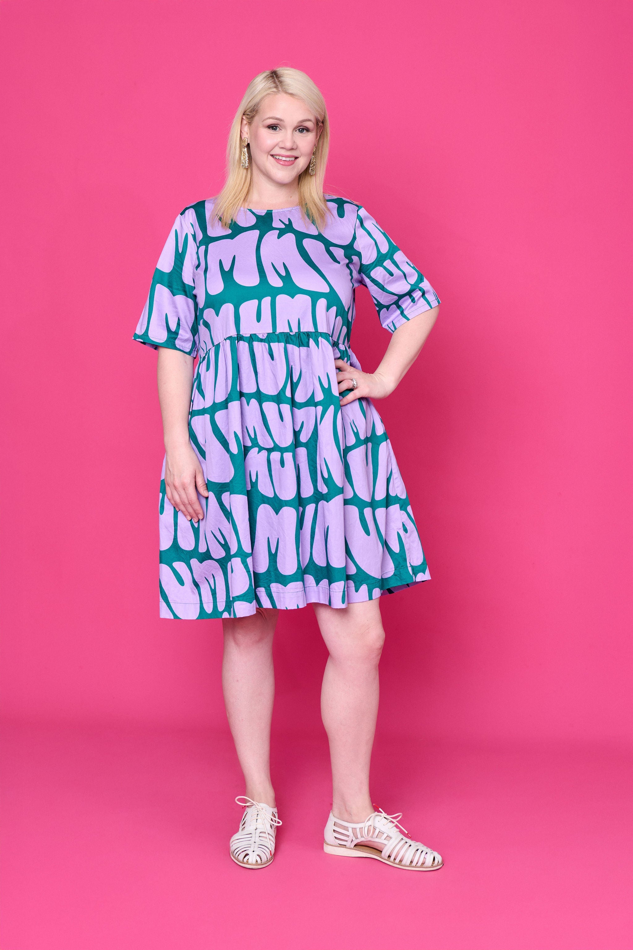Model wearing Toomi Mum Vibes purple and teal knee-length cotton babydoll print dress