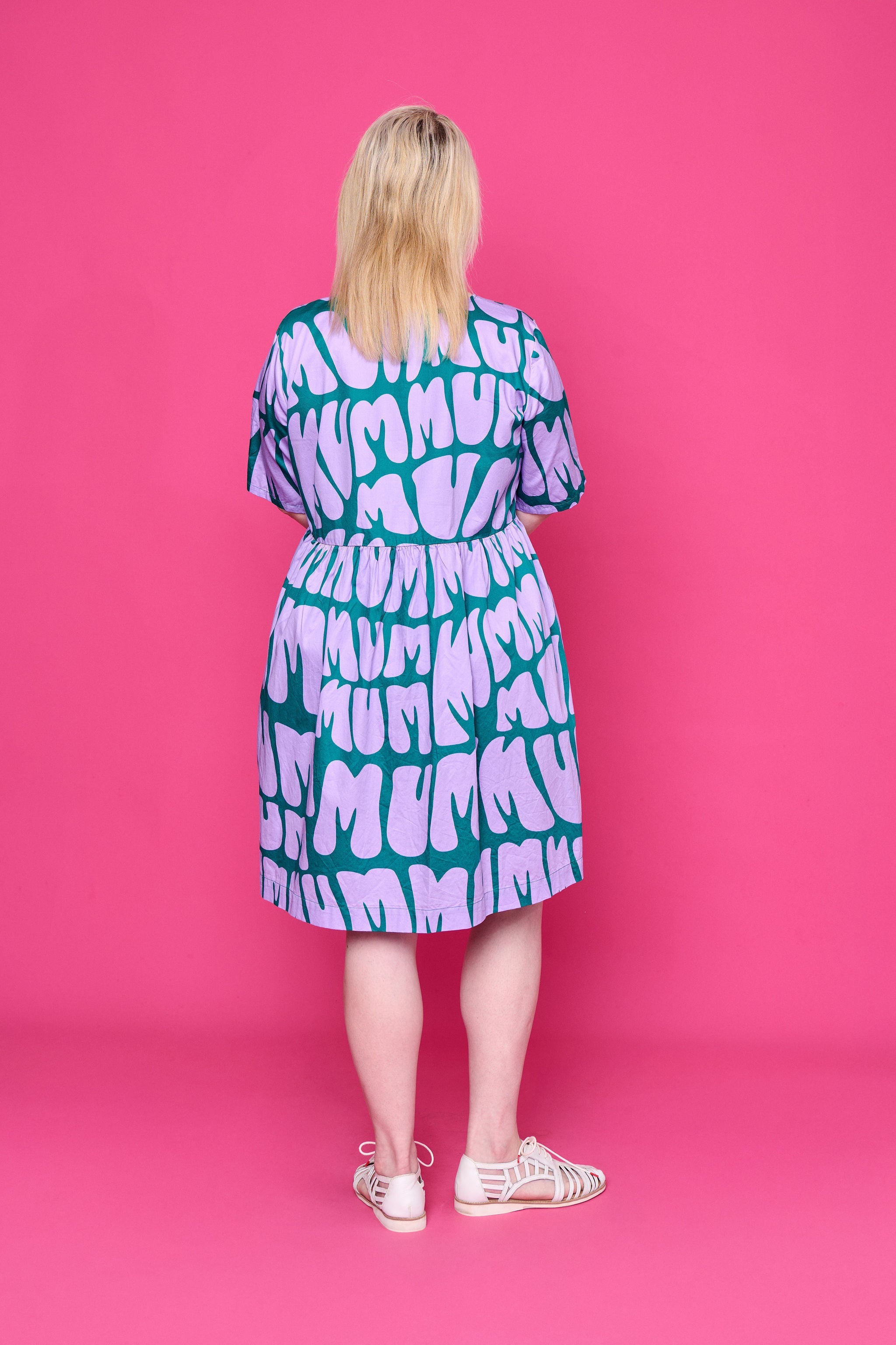 Model wearing Toomi Mum Vibes purple and teal knee-length cotton babydoll print dress