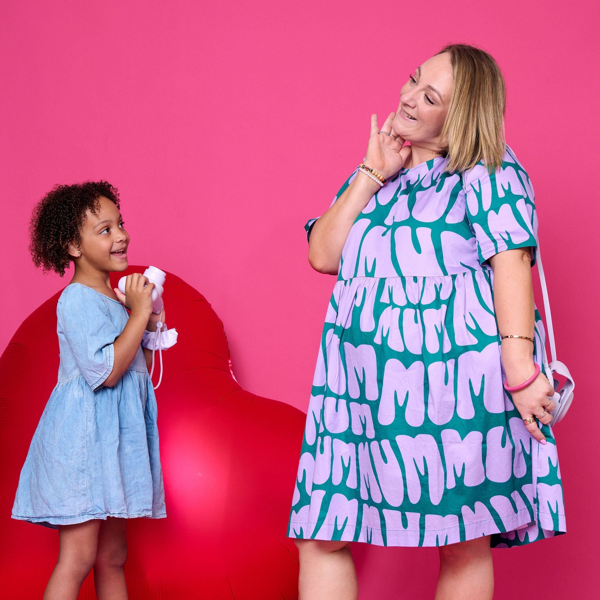 Model wearing Toomi Mum Vibes purple and teal knee-length cotton babydoll print dress