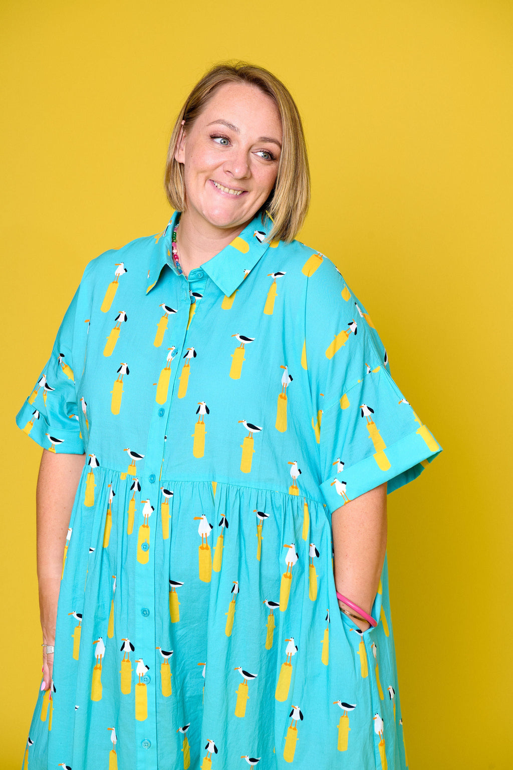 Model wearing Toomi Ultimate Maxi in Seagulls lightweight cotton v-neck dress in seagull print
