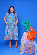 Model wearing Toomi Octopus Friends colourful v-neck cotton maxi dress in hand-illustrated octopus print
