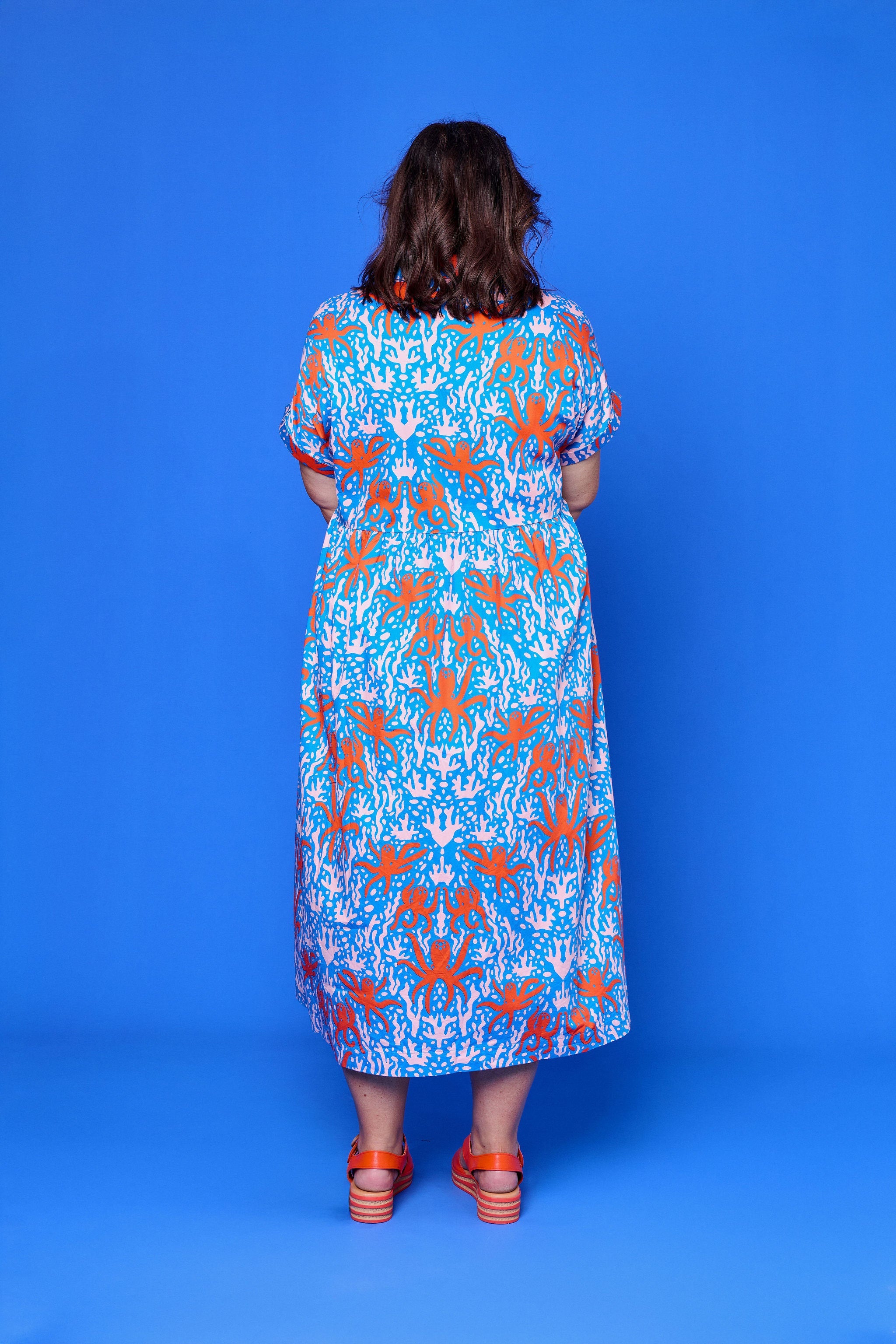 Model wearing Toomi Octopus Friends colourful v-neck cotton maxi dress in hand-illustrated octopus print