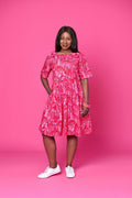 Model wearing Toomi Zebra Garden cotton maxi dress with pleated skirt in colourful zebra print