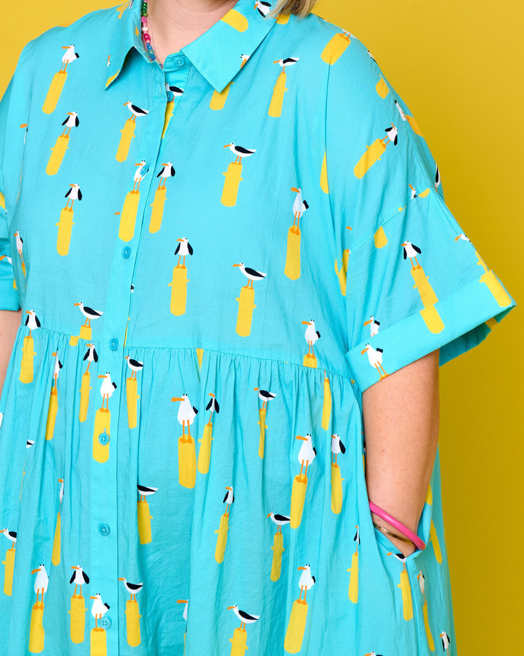 Model wearing Toomi Ultimate Maxi in Seagulls lightweight cotton v-neck dress in seagull print