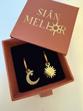 Gold sun and moon huggie hoops in gift box