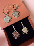 Silver sun with gem cheeks huggie hoops